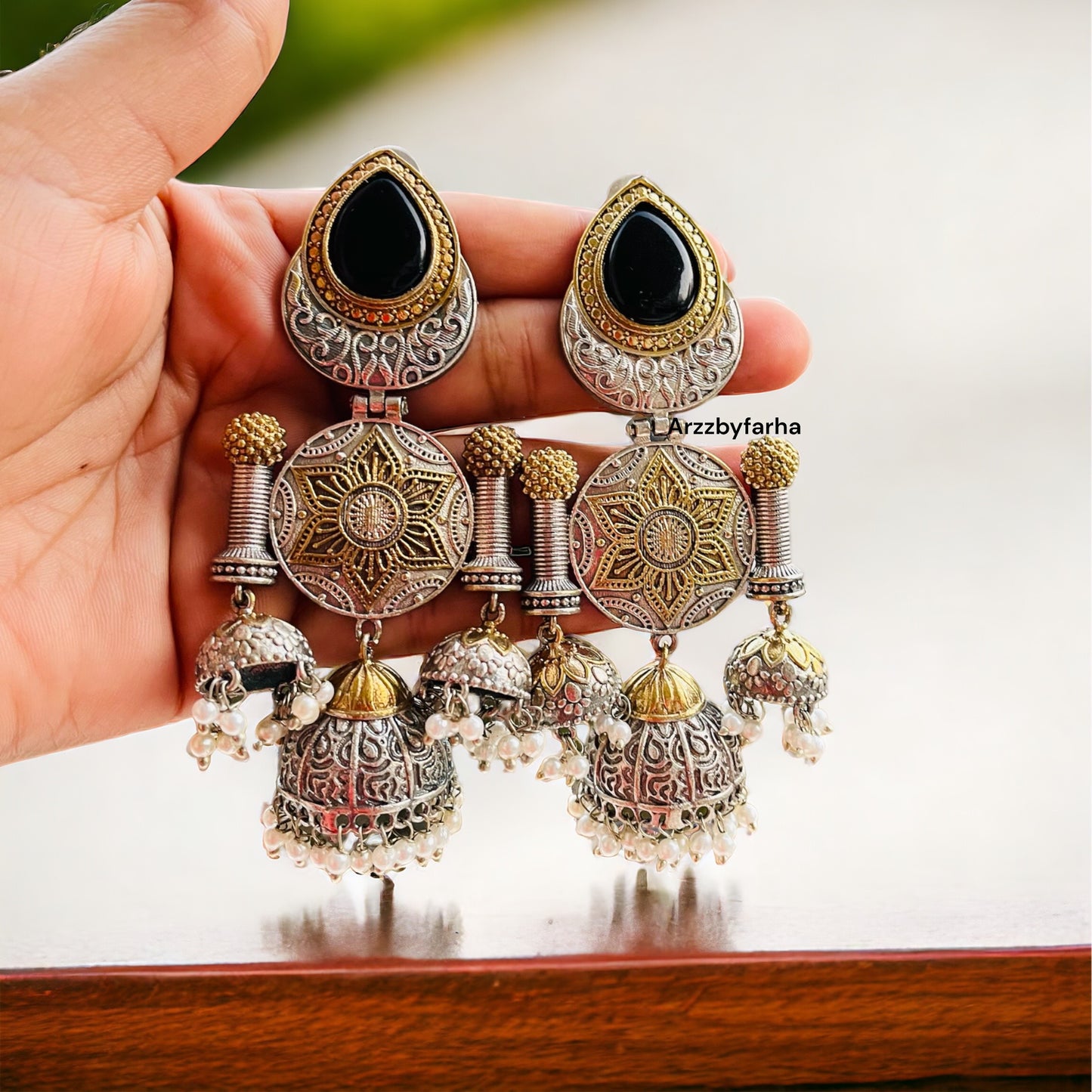 Black Dual Tone Hanging Jhumki Earrings